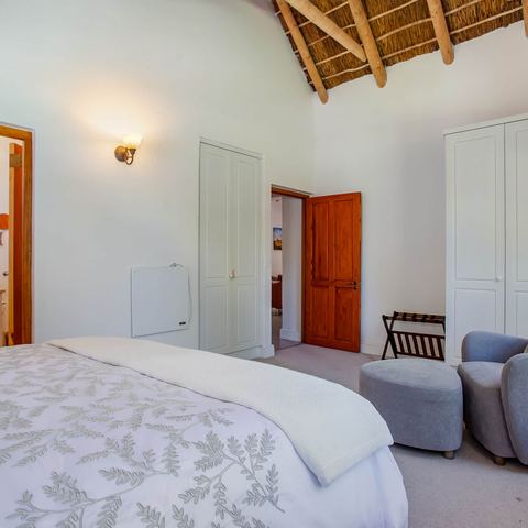 Bedroom with armchair and wardrobe