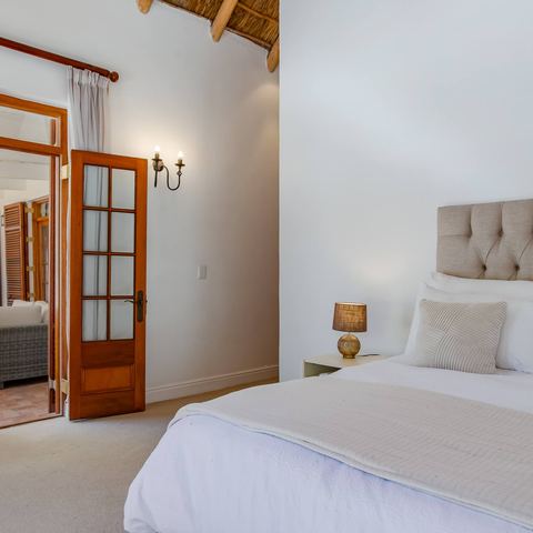 The Garden Suite, the main bedroom with French doors to the veranda