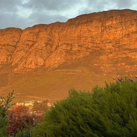 Mountains glowing at sunset from the garden