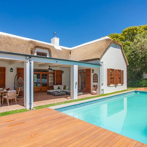 Pool and thatched house from the garden