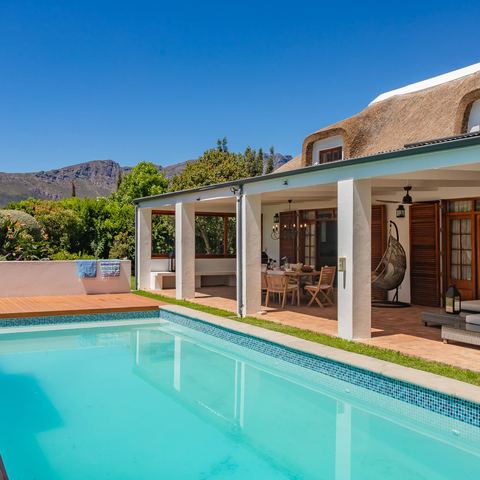 Pool and garden wing with mountain views