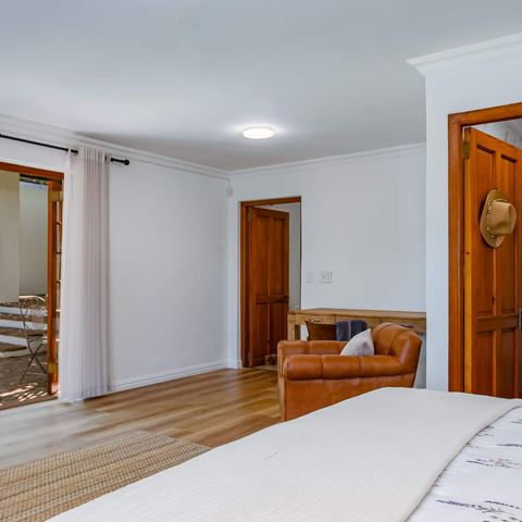 The Vine Suite, a lower-level bedroom opening onto the front patio